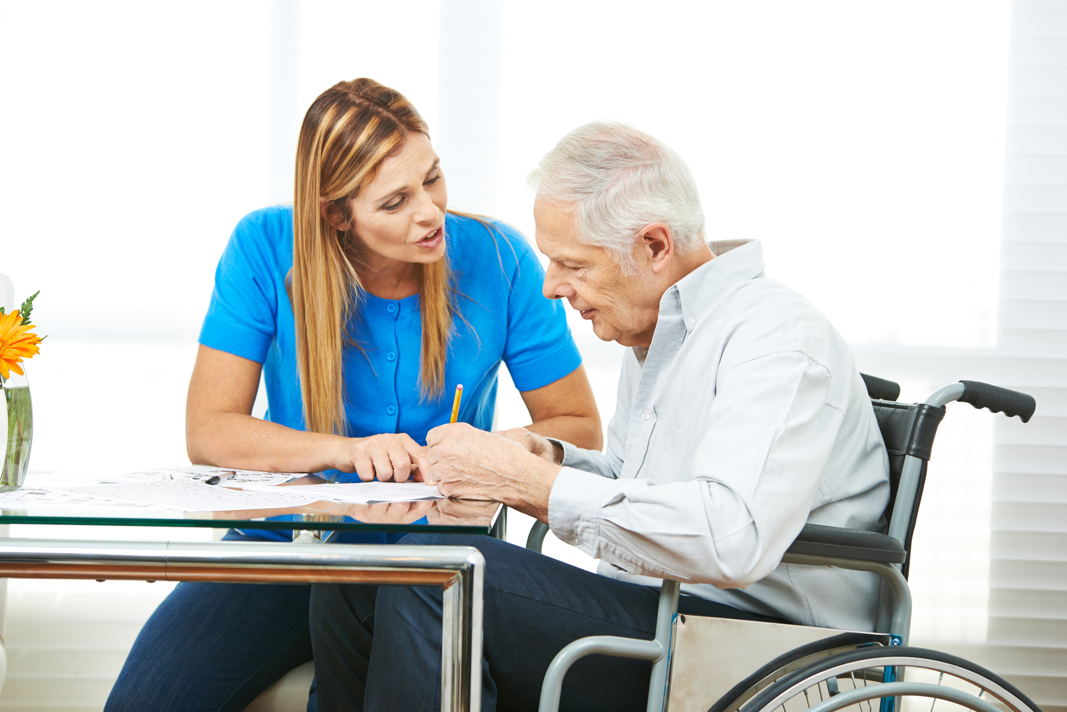 dreamstime_m_85279663 Person in wheelchair receiving services